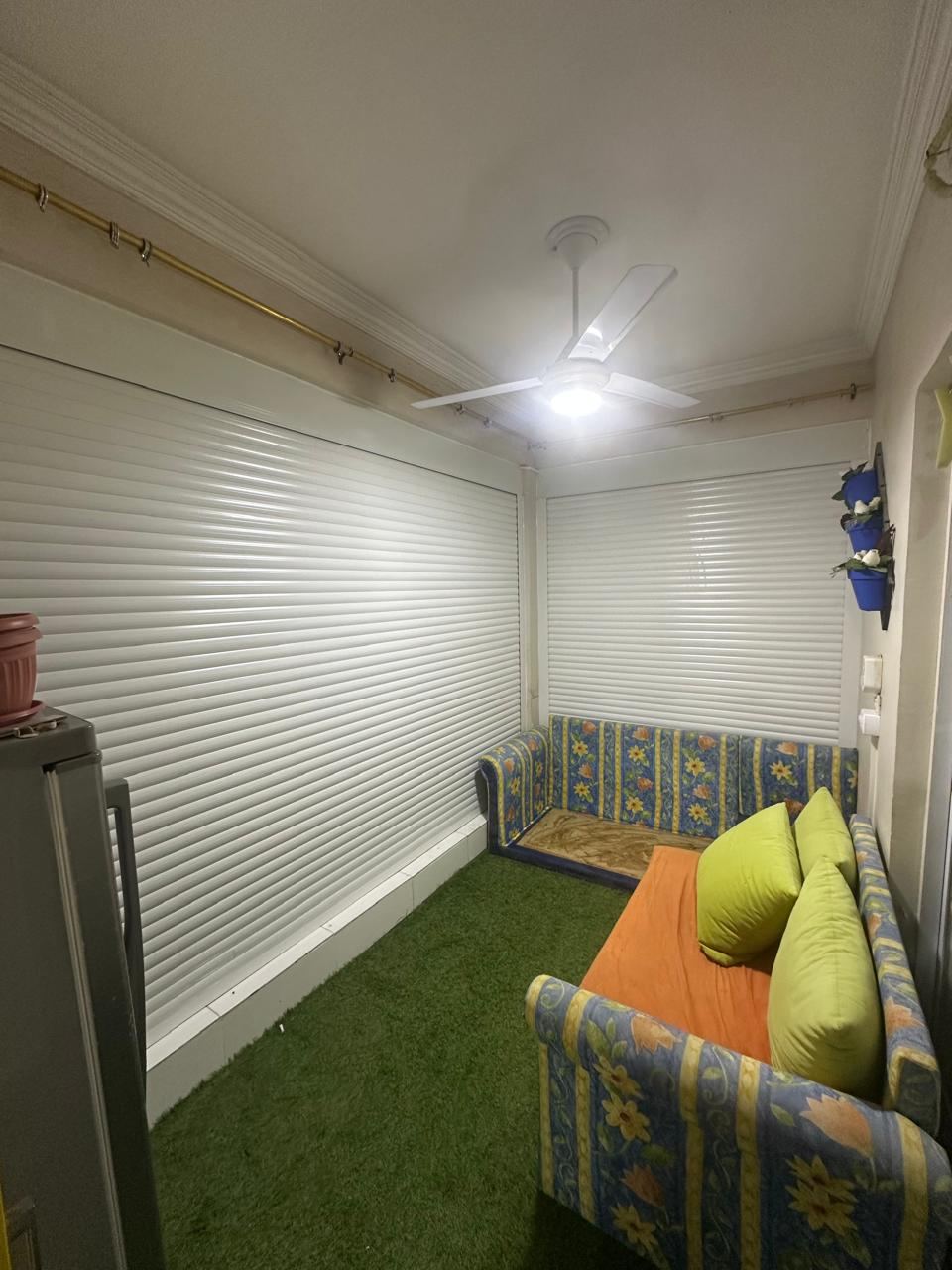 Balcony room with roller shutters