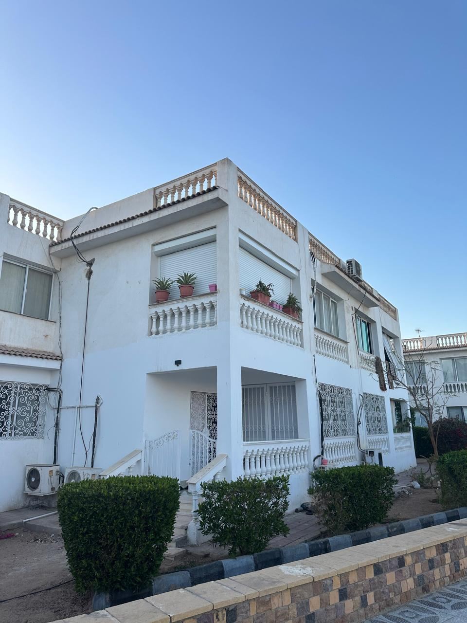 Apartment building with balcony shutters
