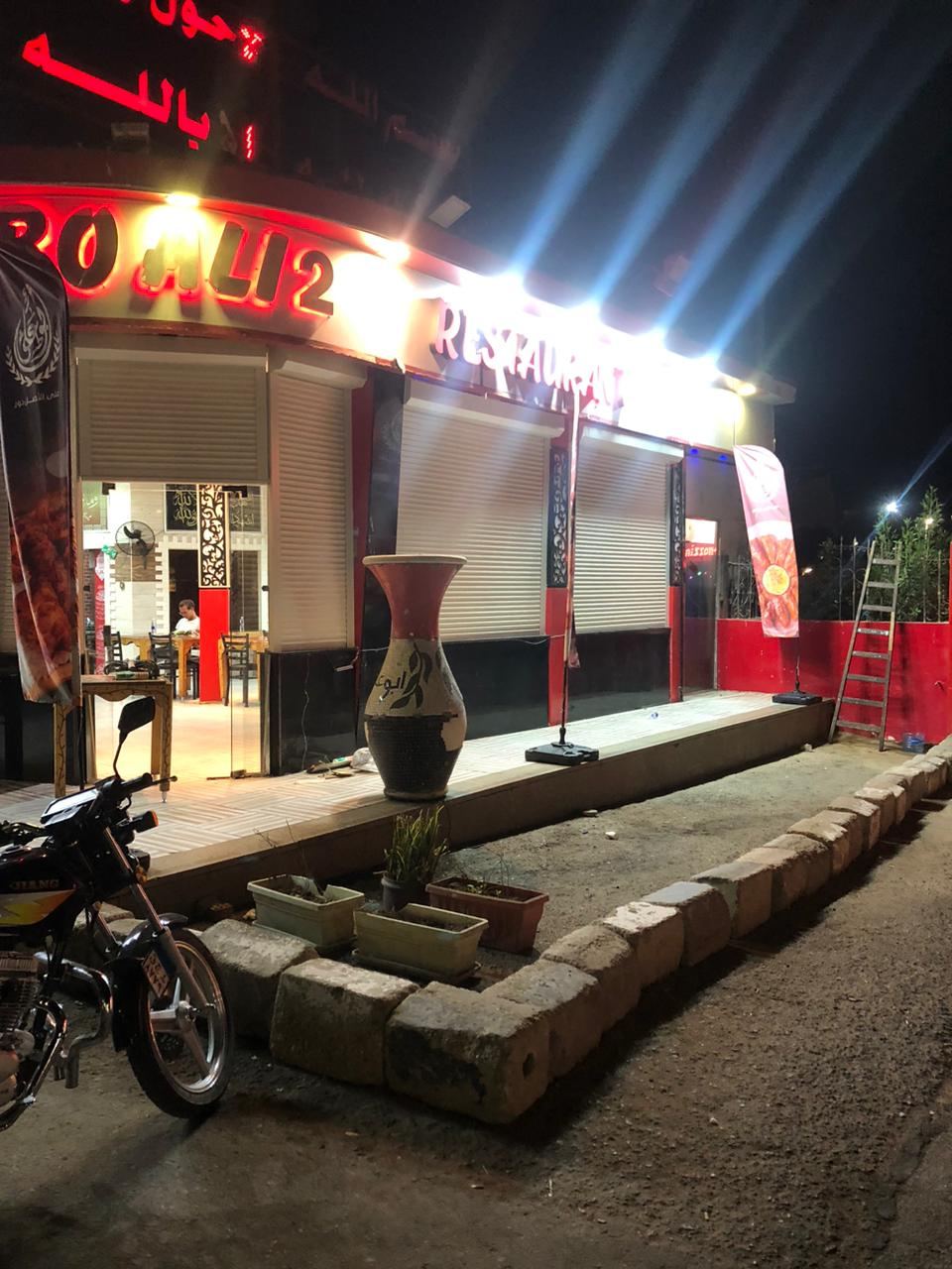 Roller shutters on a restaurant at night