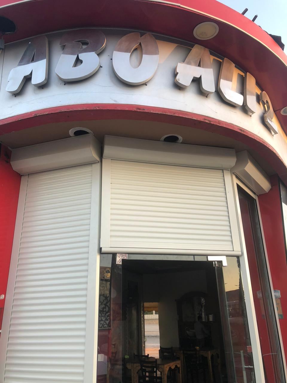 Shopfront roller shutter at night