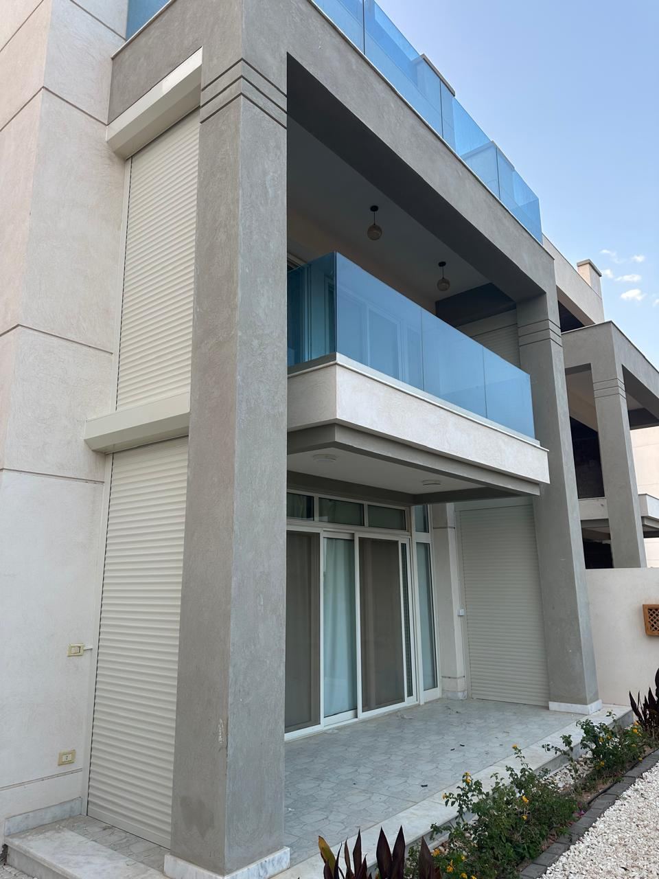Modern villa façade with shutters