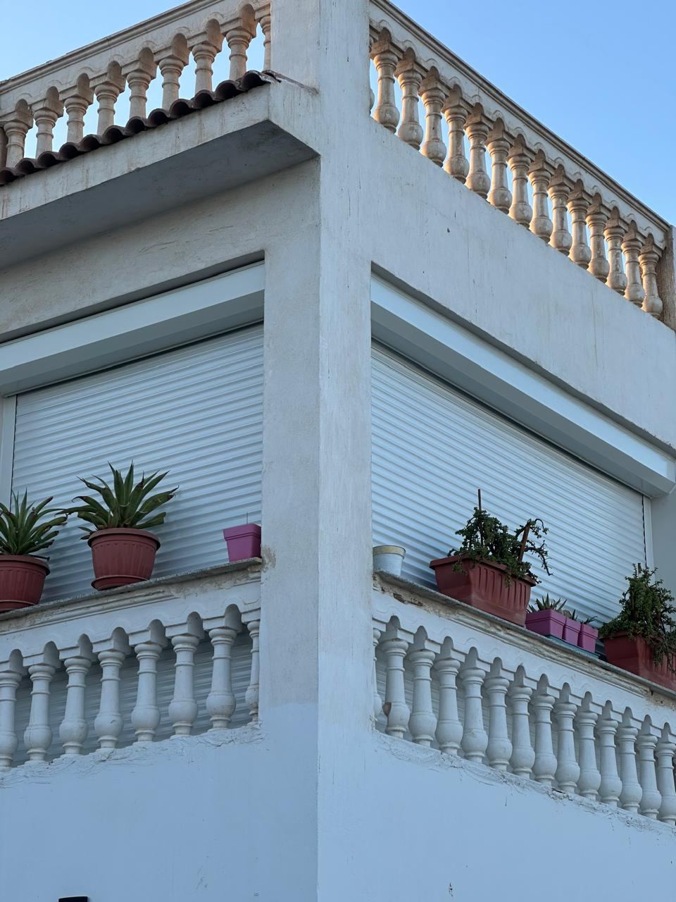 Villa balcony windows with shutters